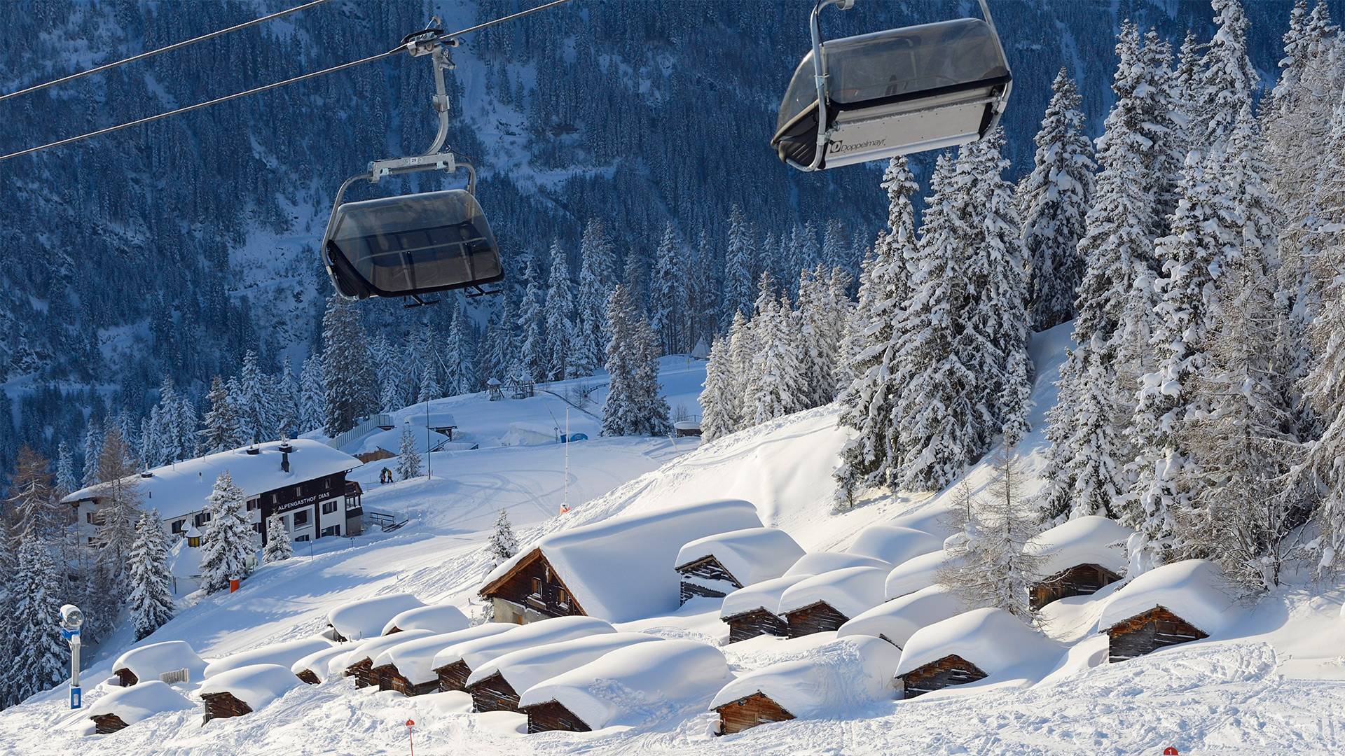 Shot of the first chairlifts in the morning on the way to the summit.
