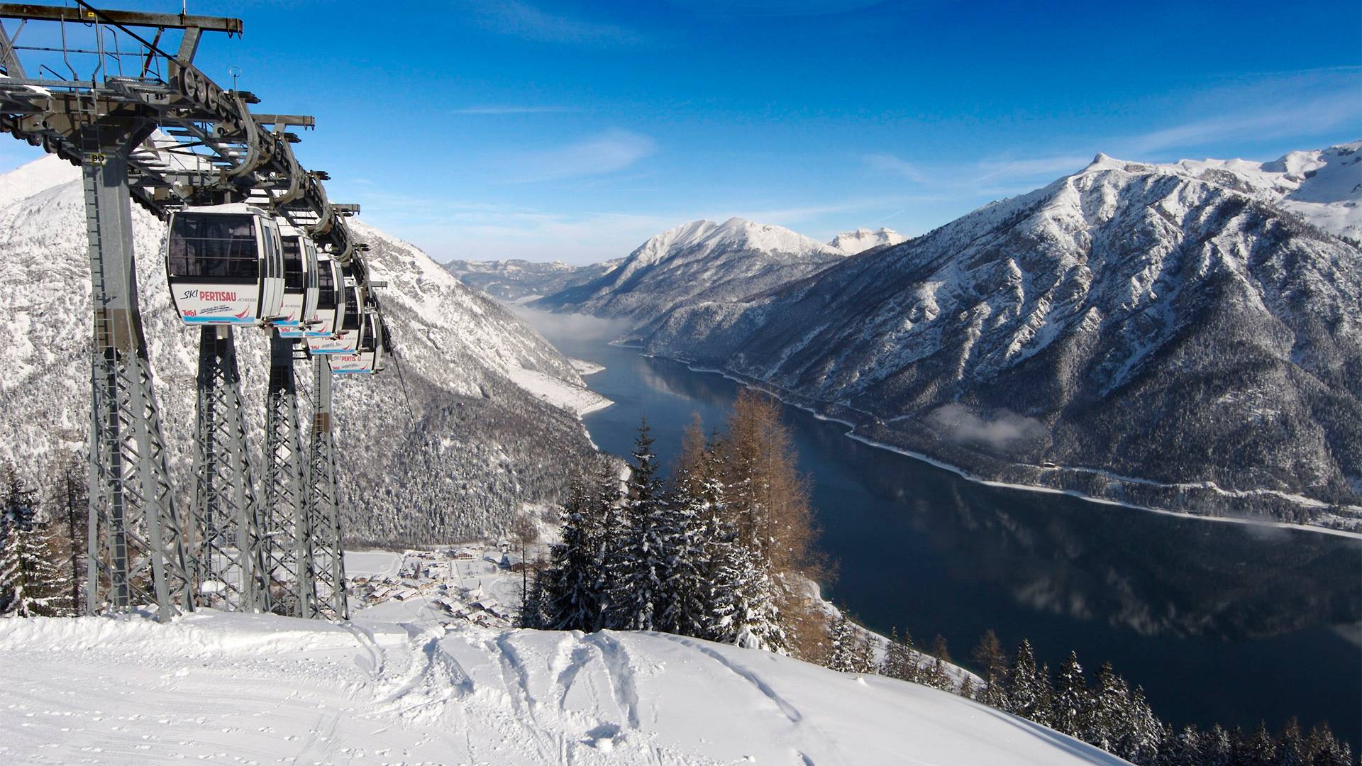 Shot of the gondola on its way to the summit, with Lake Achensee visible in the background.