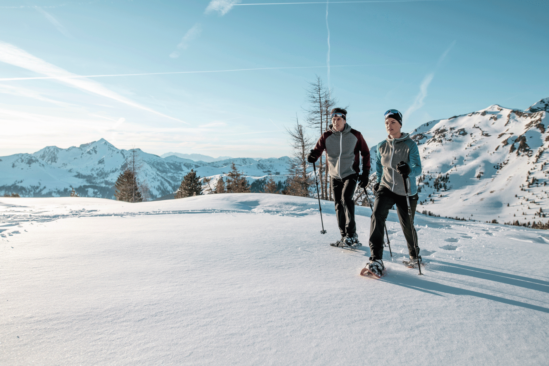Couple snowshoeing in Austria
